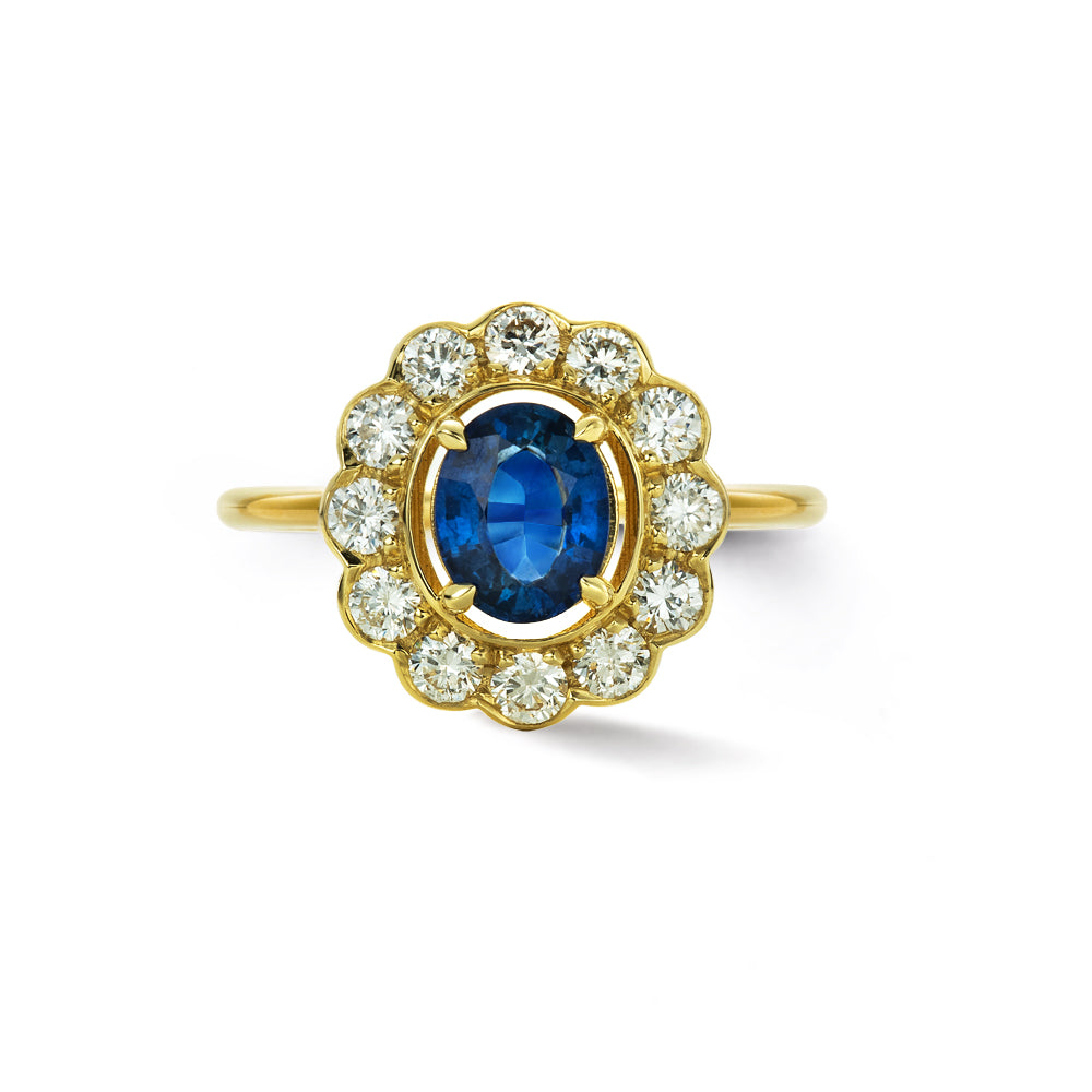 blue sapphire and gold halo ring