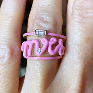 pink enamel rings on finger