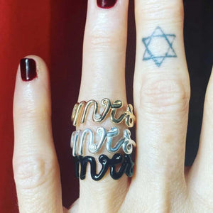 Mrs script rings on finger