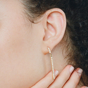 belle diamond earring on ear