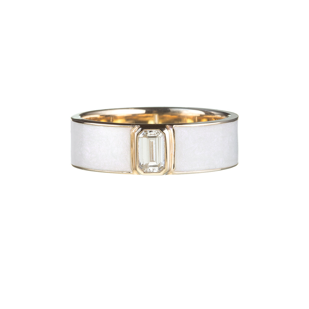 gold ring with white enamel and emerald-cut diamond